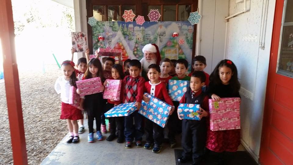 Children Holding Christmas Gifts